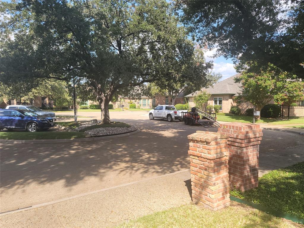 5719 Encore Drive Dallas, TX 75240 - Photo 20 of 21 a view of street with parked cars