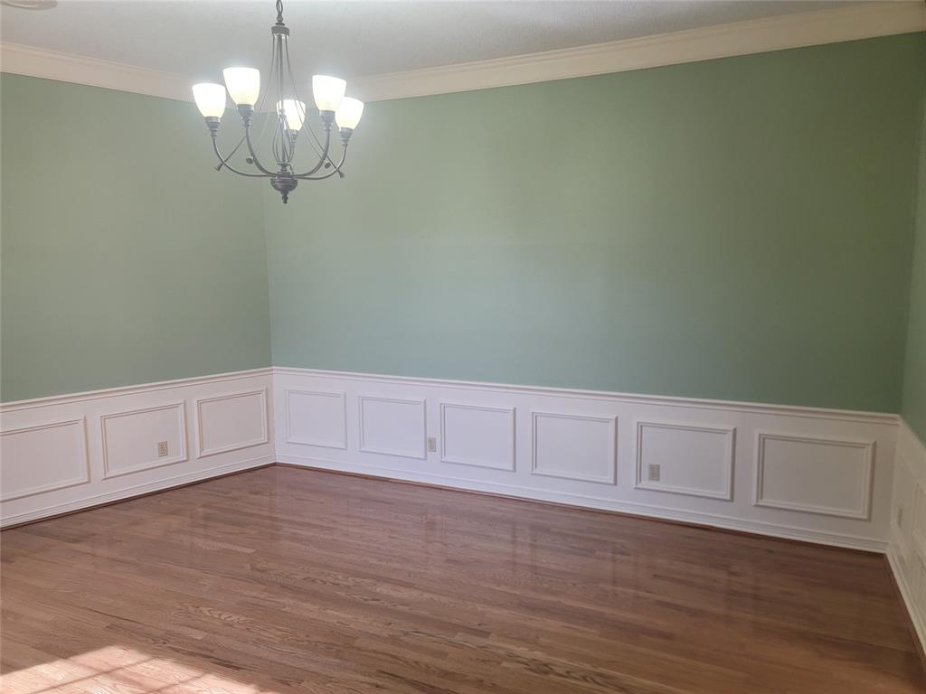 5719 Encore Drive Dallas, TX 75240 - Photo 6 of 21 a view of an empty room with wooden floor