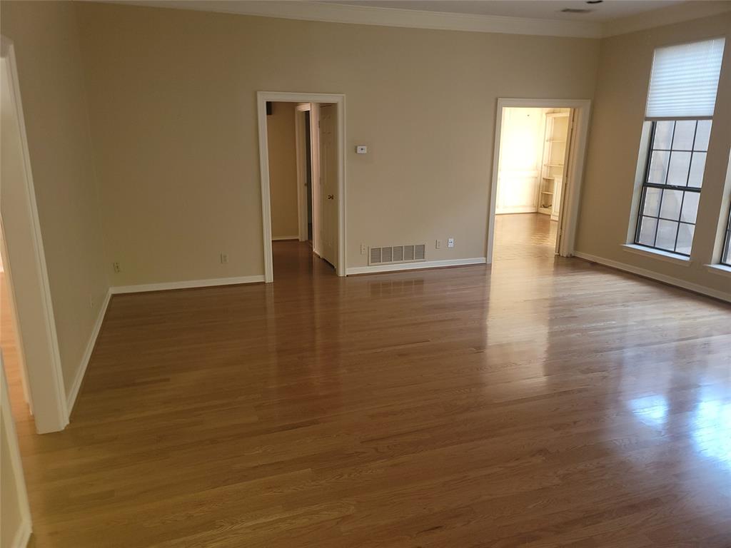 5719 Encore Drive Dallas, TX 75240 - Photo 8 of 21 wooden floor in an empty room with a window