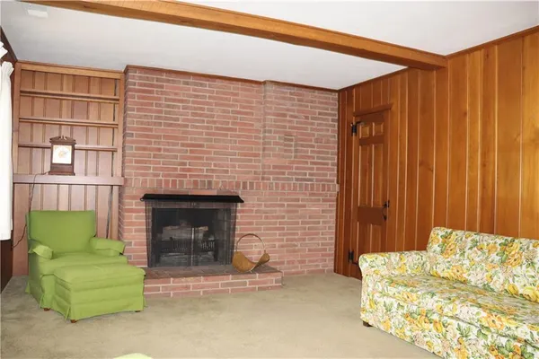 a bedroom with a bed and a fireplace
