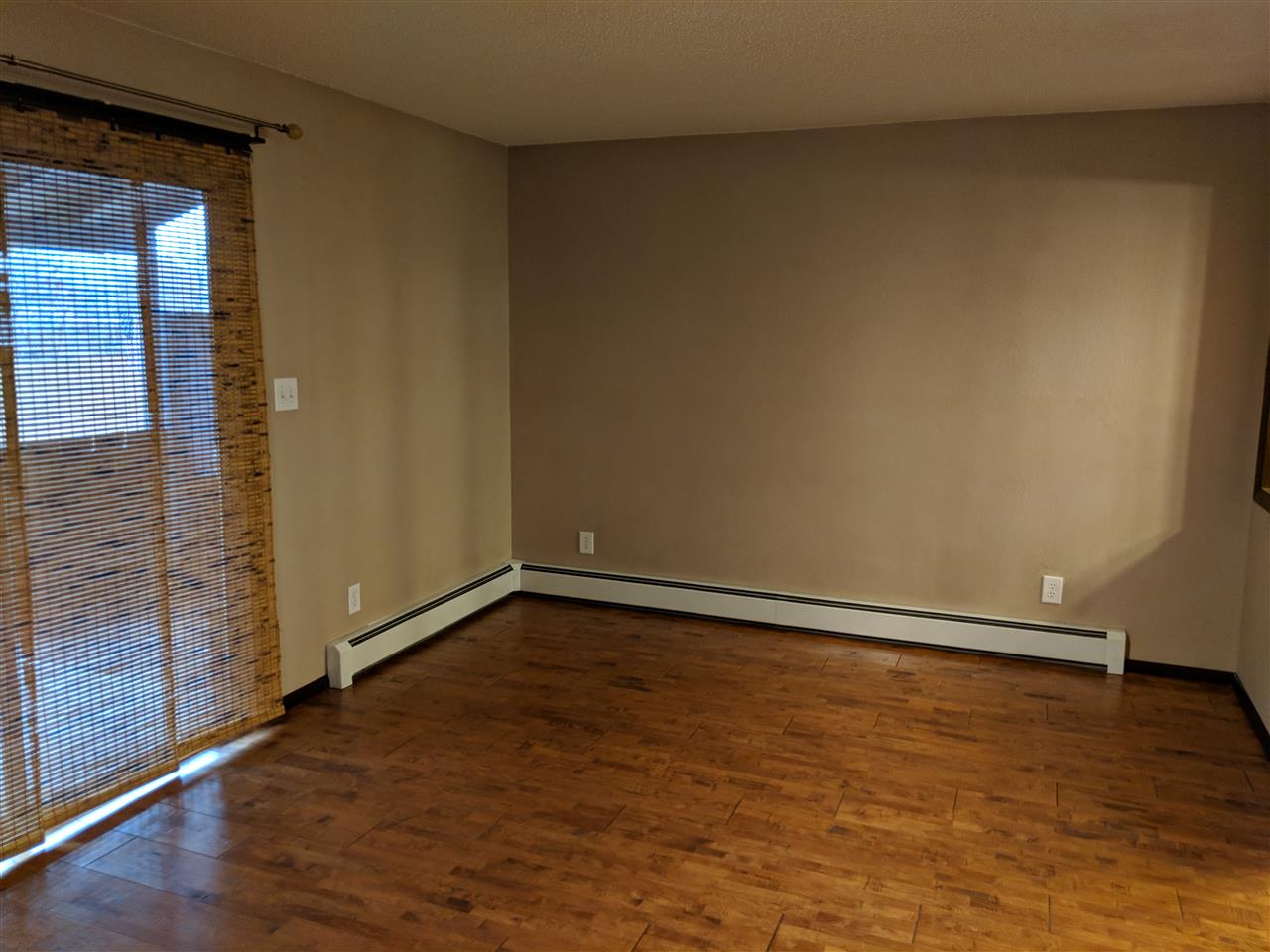 2721 Patterson Road, Unit 303 Grand Junction, CO 81506 - Photo 7 of 20 a view of an empty room and wooden floor