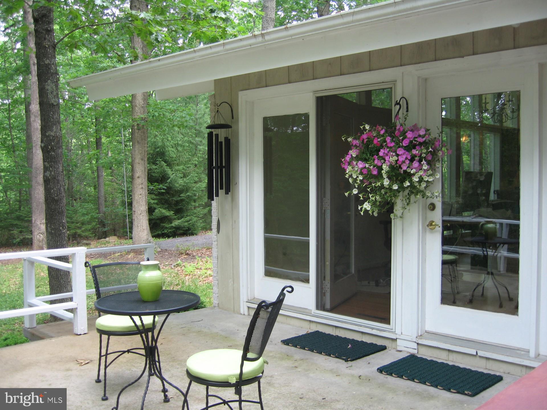 135 Lizzie Mills Road Castleton, VA 22716 - Photo 15 of 33 a view of an chairs and tables in the balcony