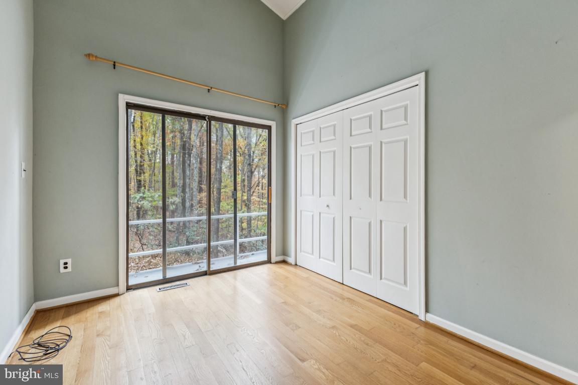 135 Lizzie Mills Road Castleton, VA 22716 - Photo 17 of 33 a view of a room with wooden floor and windows