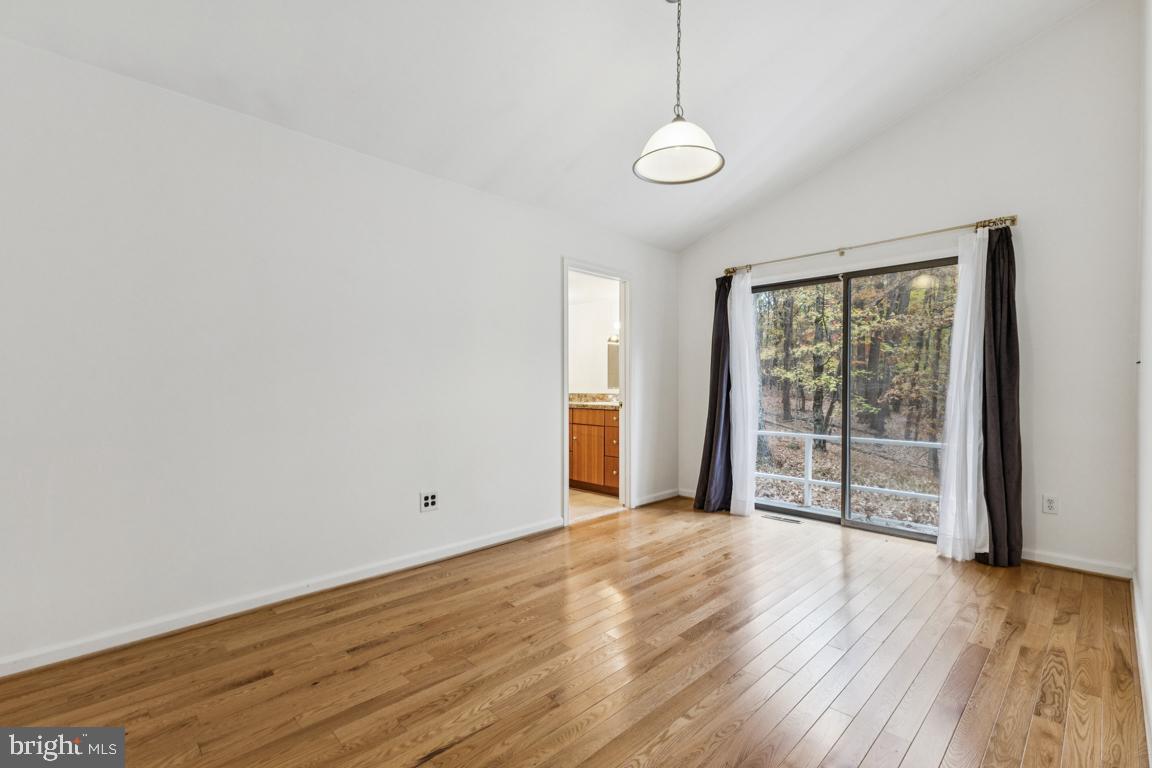 135 Lizzie Mills Road Castleton, VA 22716 - Photo 19 of 33 a view of an empty room with wooden floor and a window