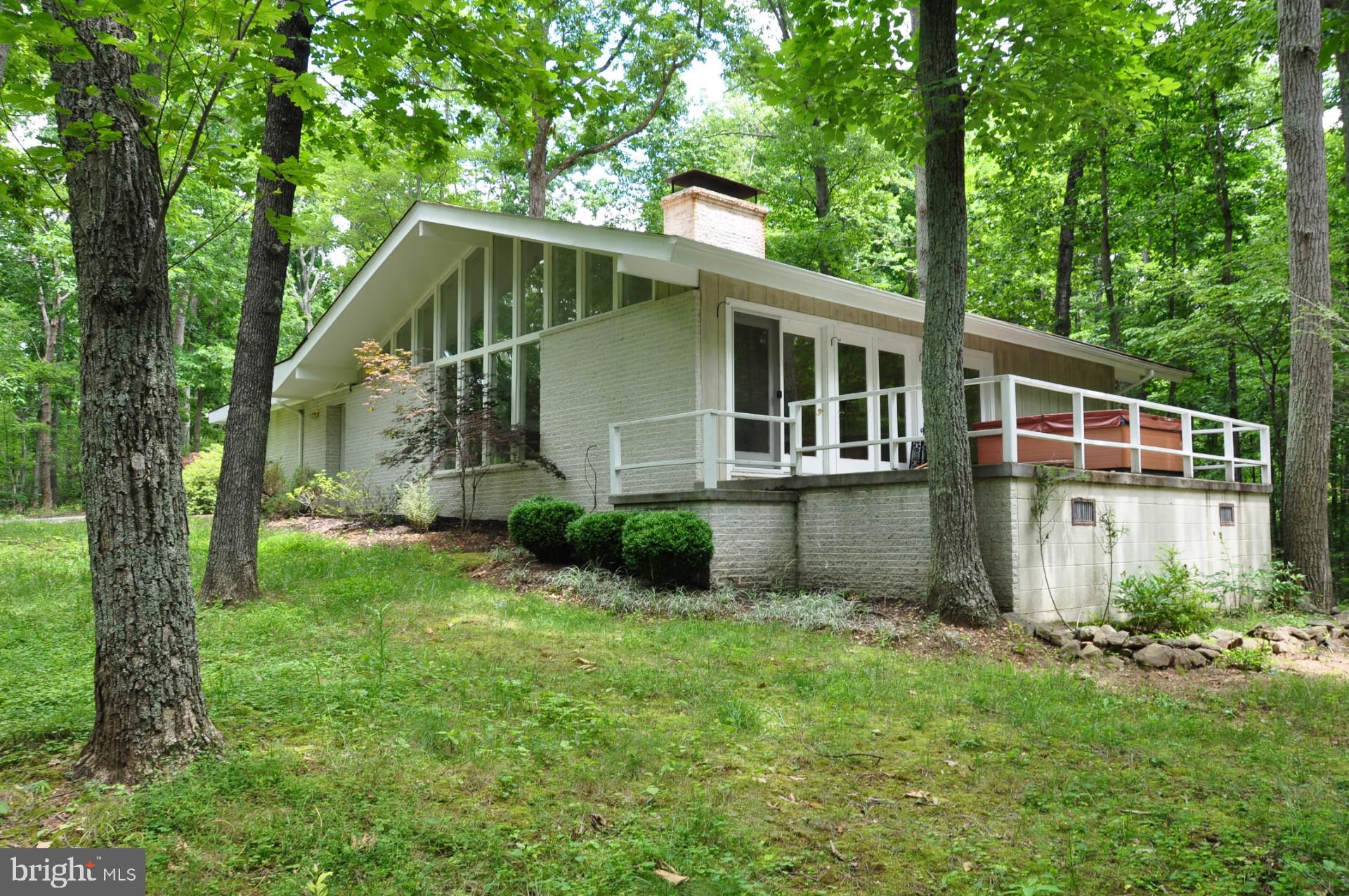 135 Lizzie Mills Road Castleton, VA 22716 - Photo 2 of 33 a house view with a garden space