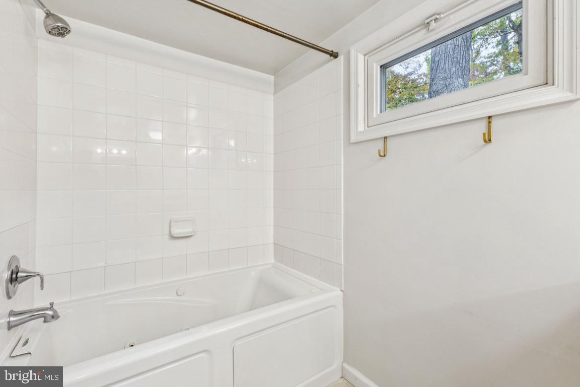 135 Lizzie Mills Road Castleton, VA 22716 - Photo 22 of 33 a bathroom with a bathtub and a shower