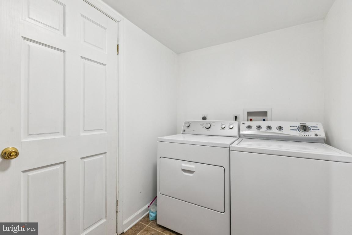135 Lizzie Mills Road Castleton, VA 22716 - Photo 23 of 33 a utility room with dryer and washer