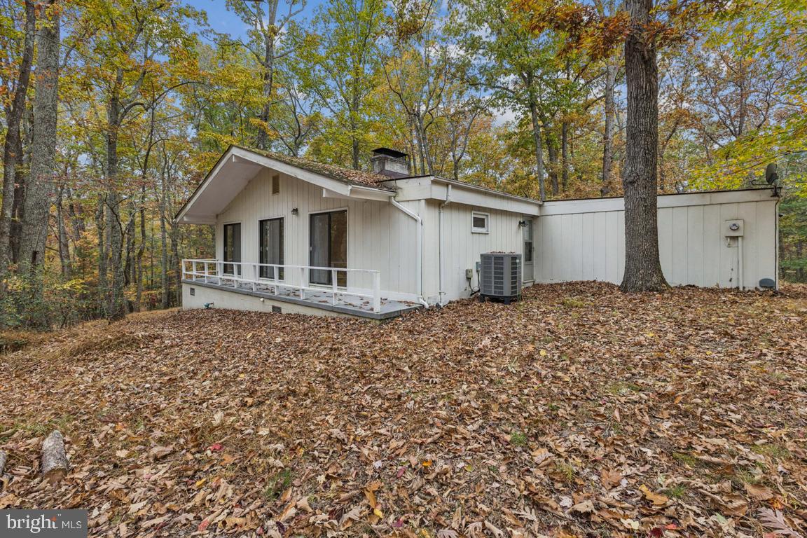 135 Lizzie Mills Road Castleton, VA 22716 - Photo 33 of 33 a house with trees in the background