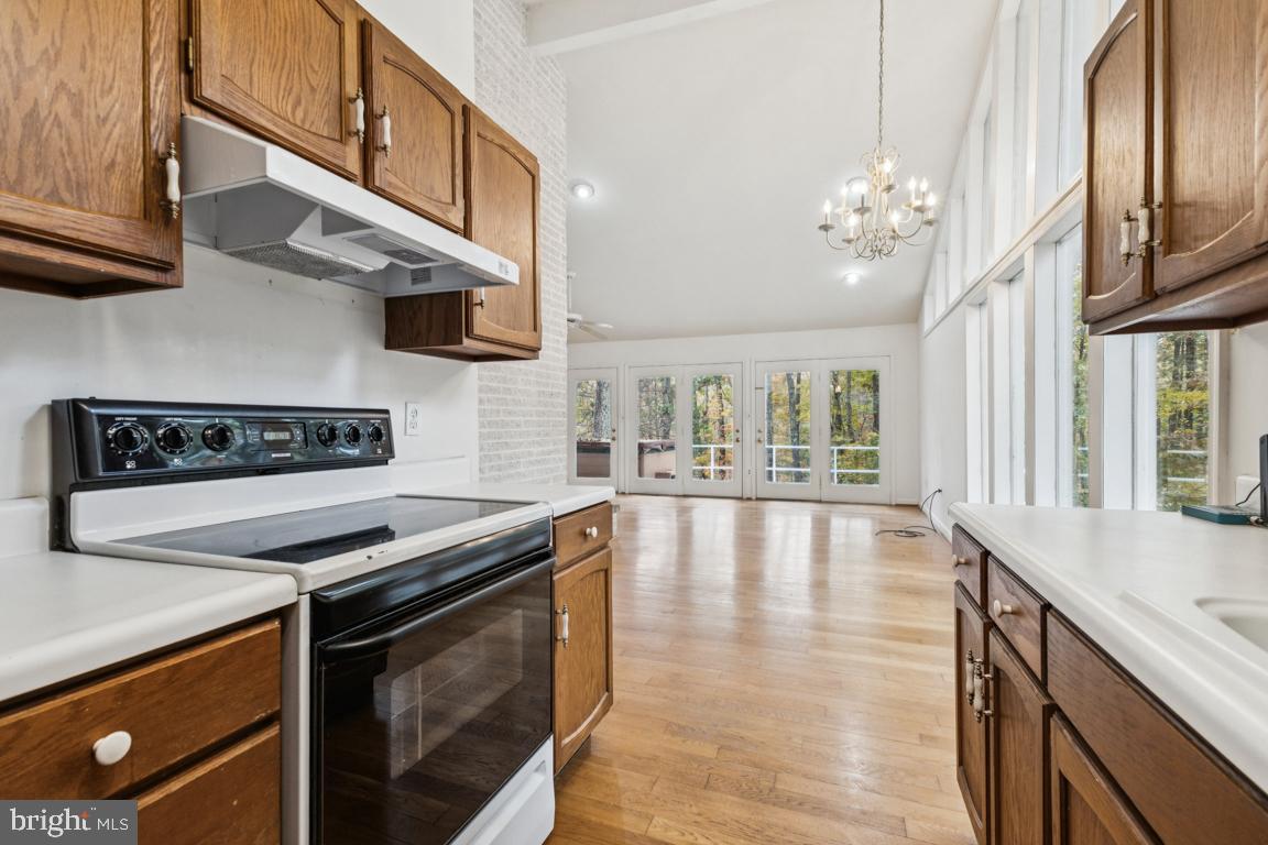 135 Lizzie Mills Road Castleton, VA 22716 - Photo 9 of 33 a view of a kitchen with stainless steel appliances granite countertop a stove and a sink