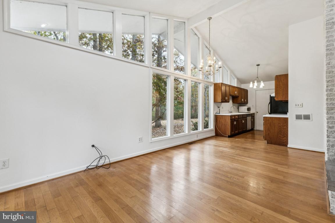 135 Lizzie Mills Road Castleton, VA 22716 - Photo 10 of 33 a view of a room with wooden floor and windows