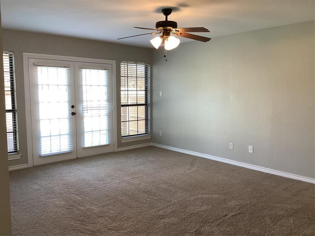 485 Cherokee Trail Keller, TX 76248 - Photo 20 of 33 an empty room with windows and ceiling fan