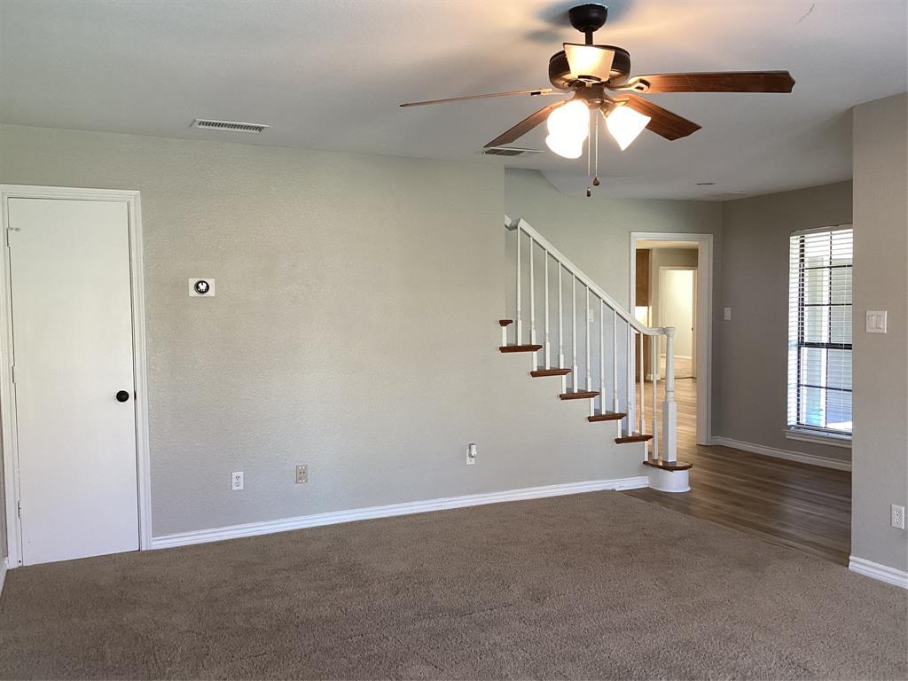 485 Cherokee Trail Keller, TX 76248 - Photo 21 of 33 a view of an empty room with a chandelier fan
