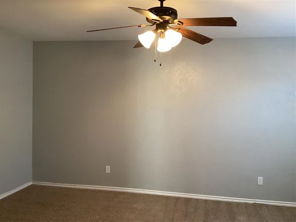 a view of a small space with a fan