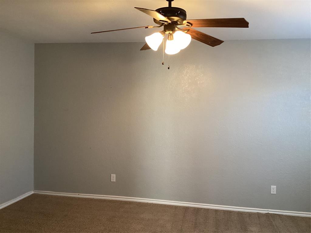 485 Cherokee Trail Keller, TX 76248 - Photo 29 of 33 an empty room with a window and a fan
