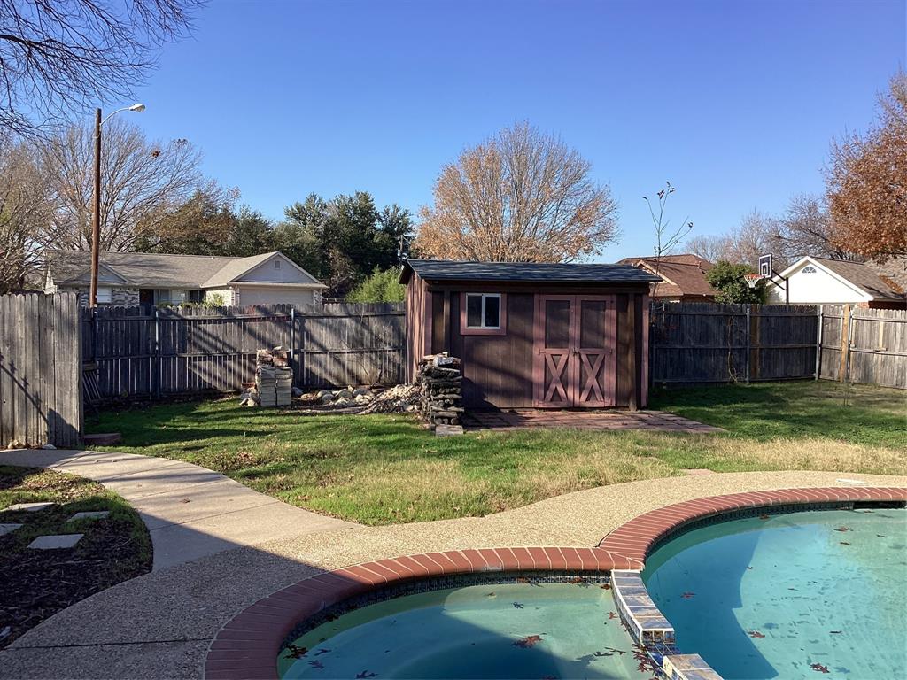 485 Cherokee Trail Keller, TX 76248 - Photo 32 of 33 a view of a backyard with a tub and trees in the background