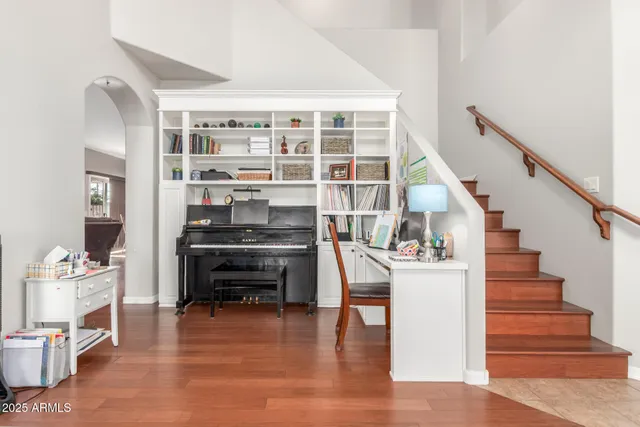a living room with furniture a rug and a window