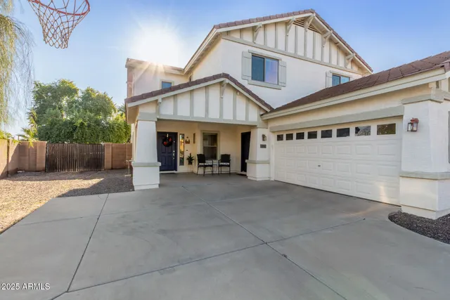 a view of an entryway with wooden floor and door