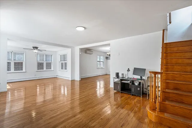 a view of a livingroom with wooden floor