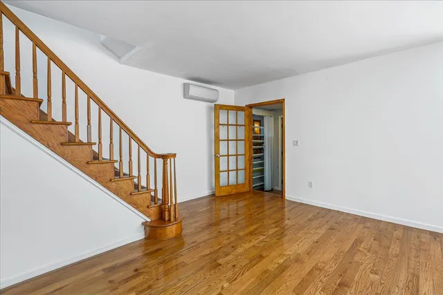 a view of an entryway with wooden floor