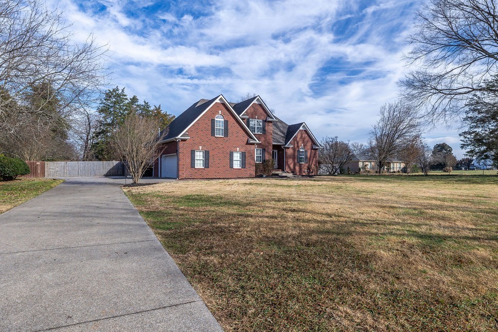 6502 Franklin Road Murfreesboro, TN 37128 - Photo 12 of 36 a view of swimming pool with a yard