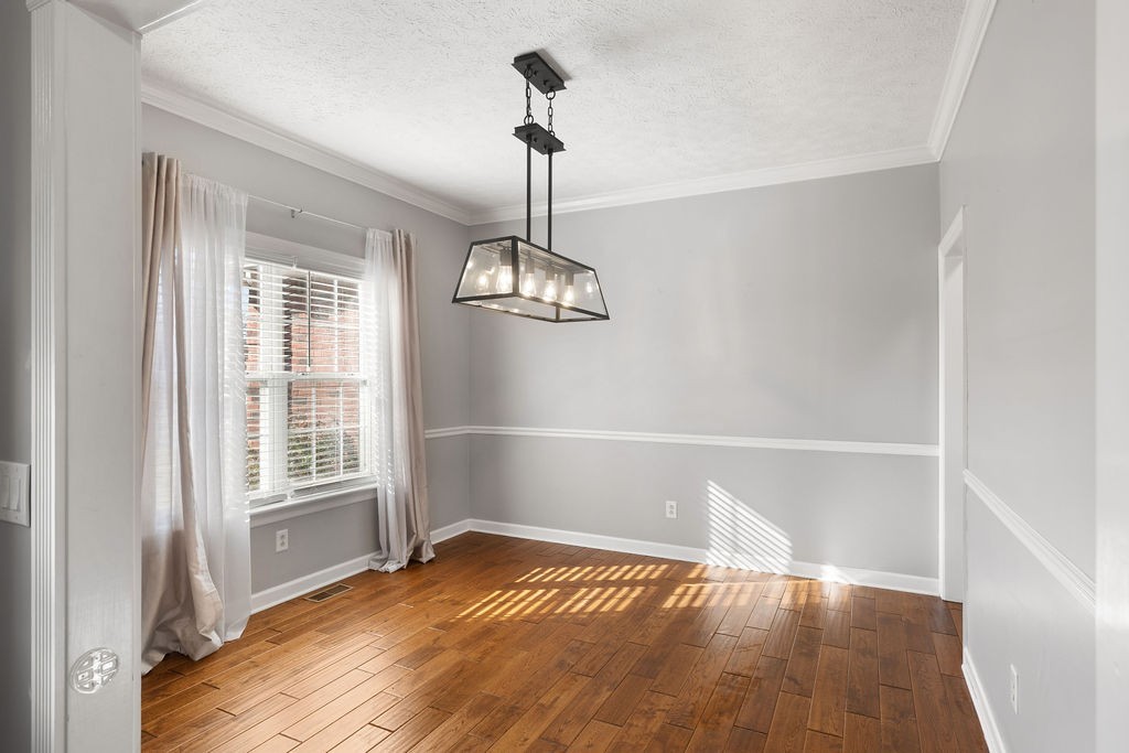 6502 Franklin Road Murfreesboro, TN 37128 - Photo 16 of 36 a view of empty room with wooden floor and fan