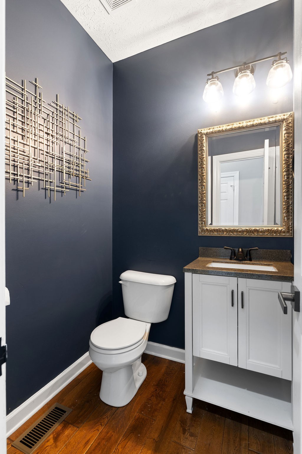 6502 Franklin Road Murfreesboro, TN 37128 - Photo 22 of 36 a bathroom with a toilet sink and mirror