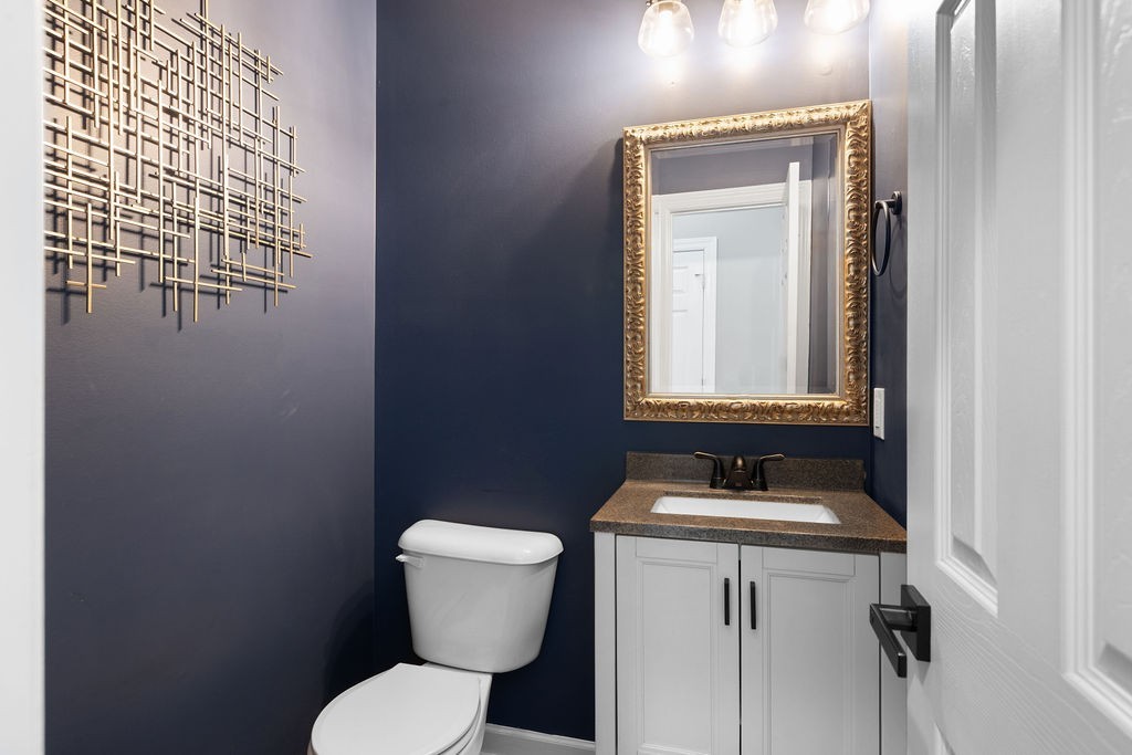 6502 Franklin Road Murfreesboro, TN 37128 - Photo 23 of 36 a bathroom with a toilet sink and mirror