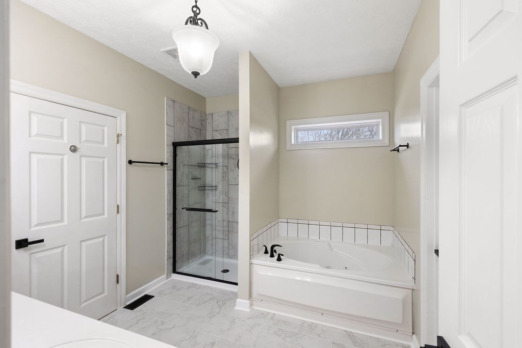 6502 Franklin Road Murfreesboro, TN 37128 - Photo 24 of 36 a bathroom with a bathtub and a shower