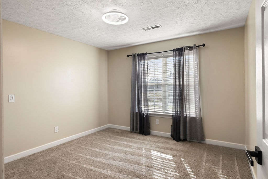 6502 Franklin Road Murfreesboro, TN 37128 - Photo 26 of 36 a view of an empty room with a window
