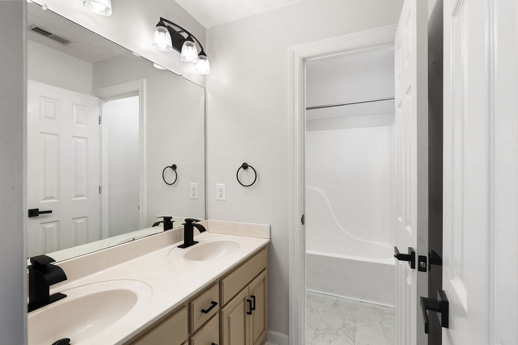 6502 Franklin Road Murfreesboro, TN 37128 - Photo 29 of 36 a bathroom with a sink a toilet and shower