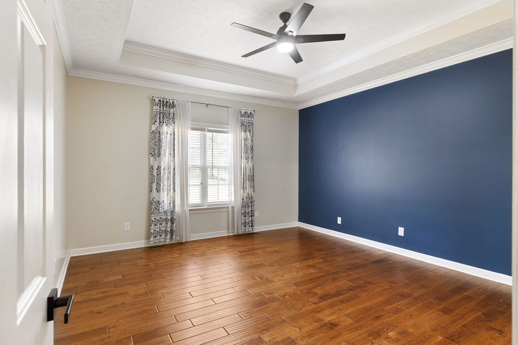 6502 Franklin Road Murfreesboro, TN 37128 - Photo 8 of 36 a view of an empty room with window and wooden floor