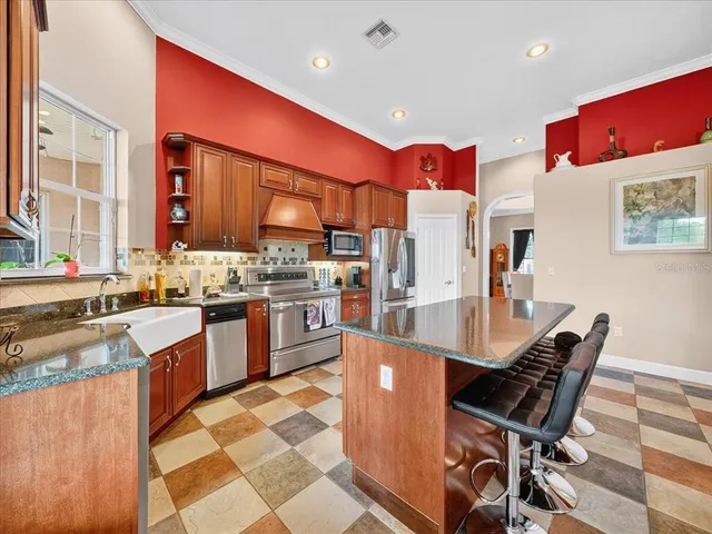 a living room with furniture a rug and wooden floor