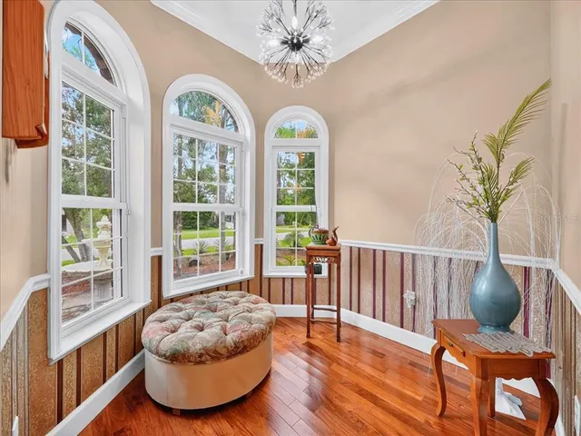 a bed room with a bed and a chandelier