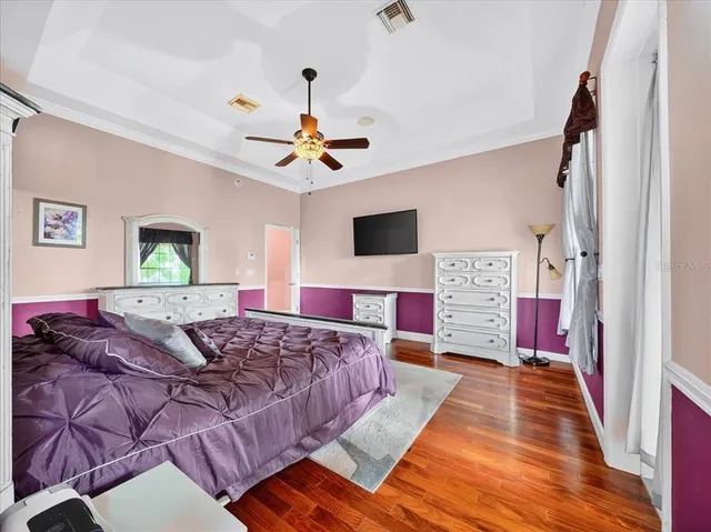 a living room with furniture fireplace and a large window