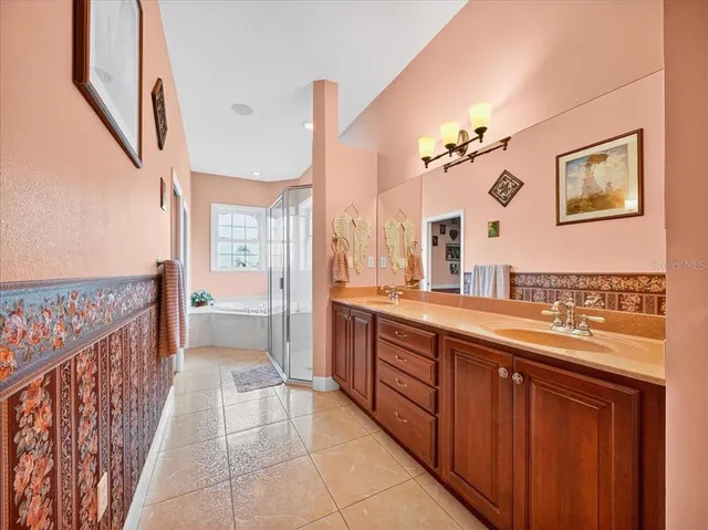 a large bathroom with a bathtub and a sink