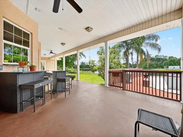 a view of a house with a yard porch and sitting area