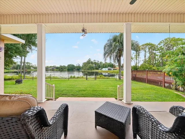 a view of a balcony with yard