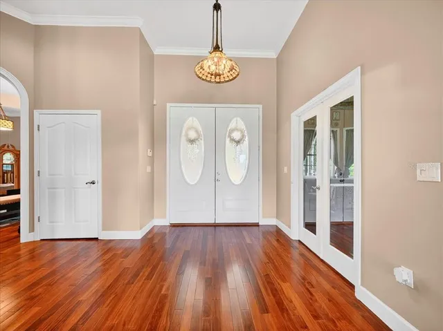 a living room with furniture fireplace and a large window