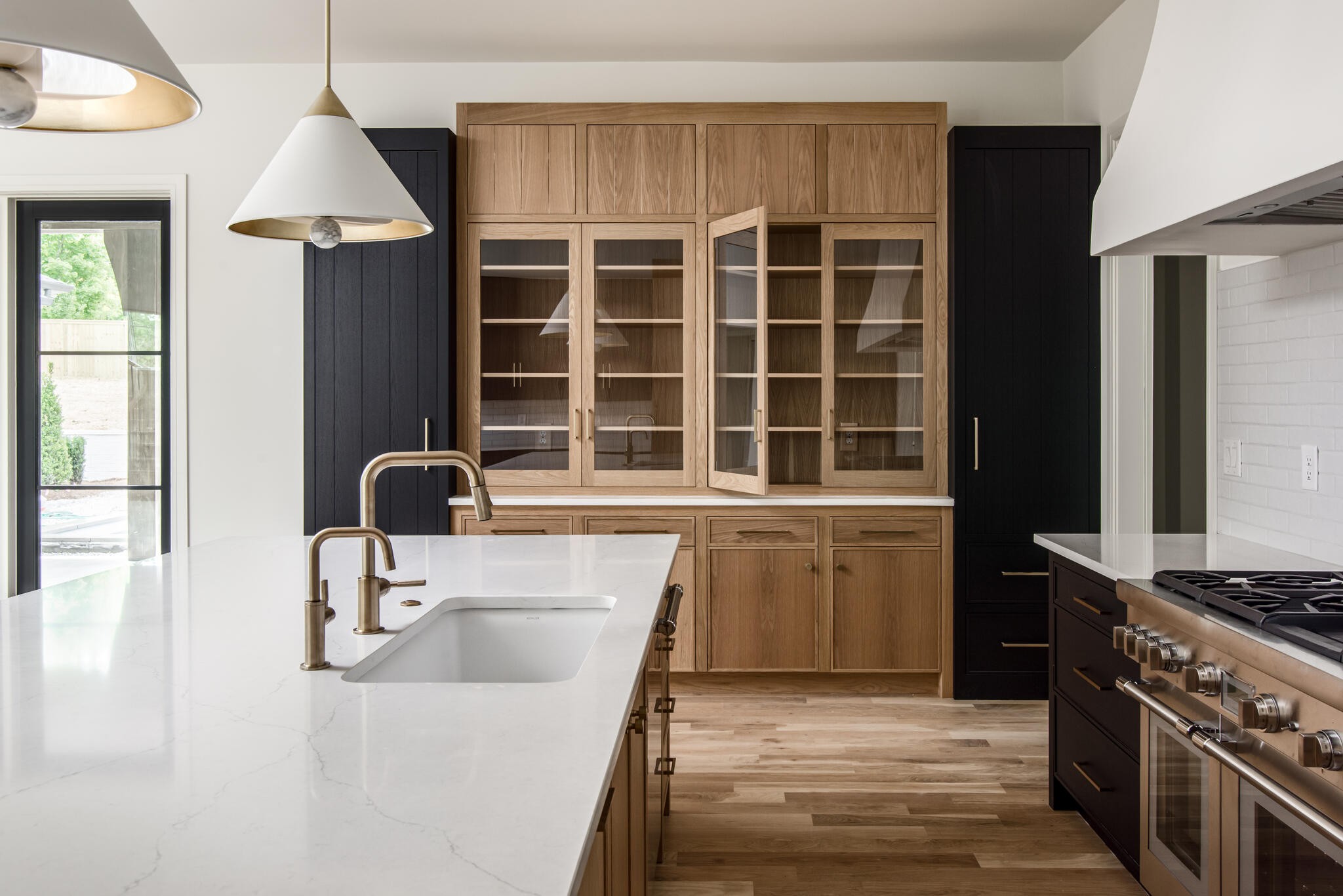 1401 Burton Valley Road Nashville, TN 37215 - Photo 24 of 68 a kitchen with a sink a stove and a window