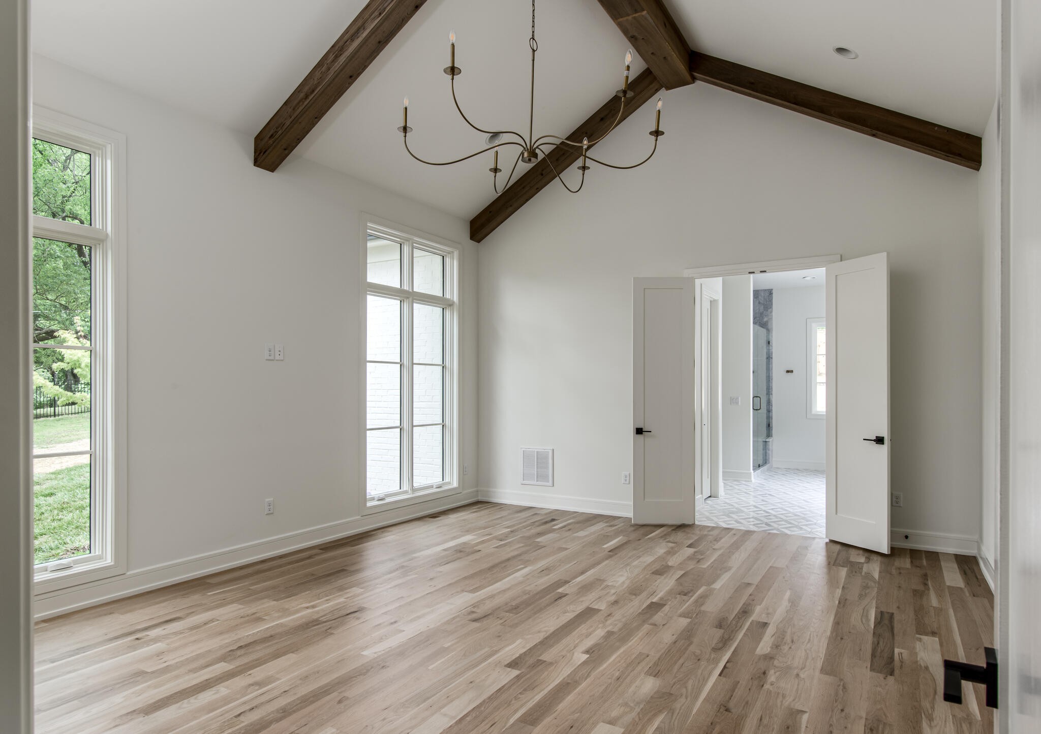 1401 Burton Valley Road Nashville, TN 37215 - Photo 30 of 68 a view of empty room with wooden floor and fan