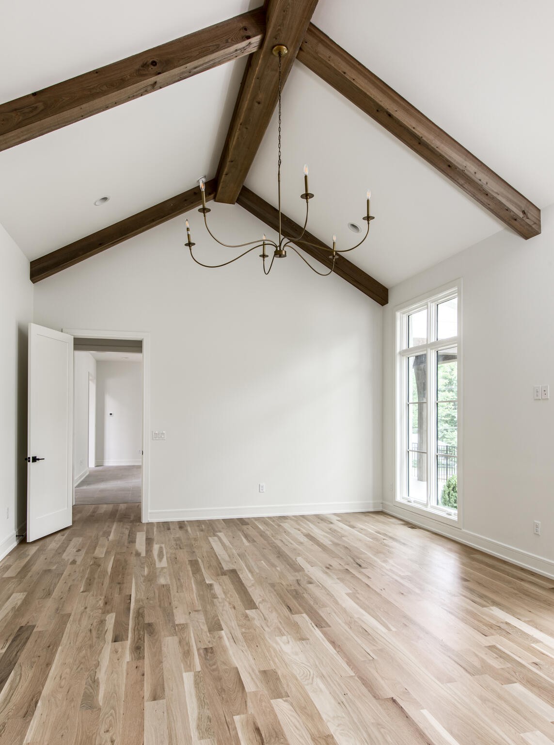1401 Burton Valley Road Nashville, TN 37215 - Photo 31 of 68 a view of a big room with wooden floor and windows