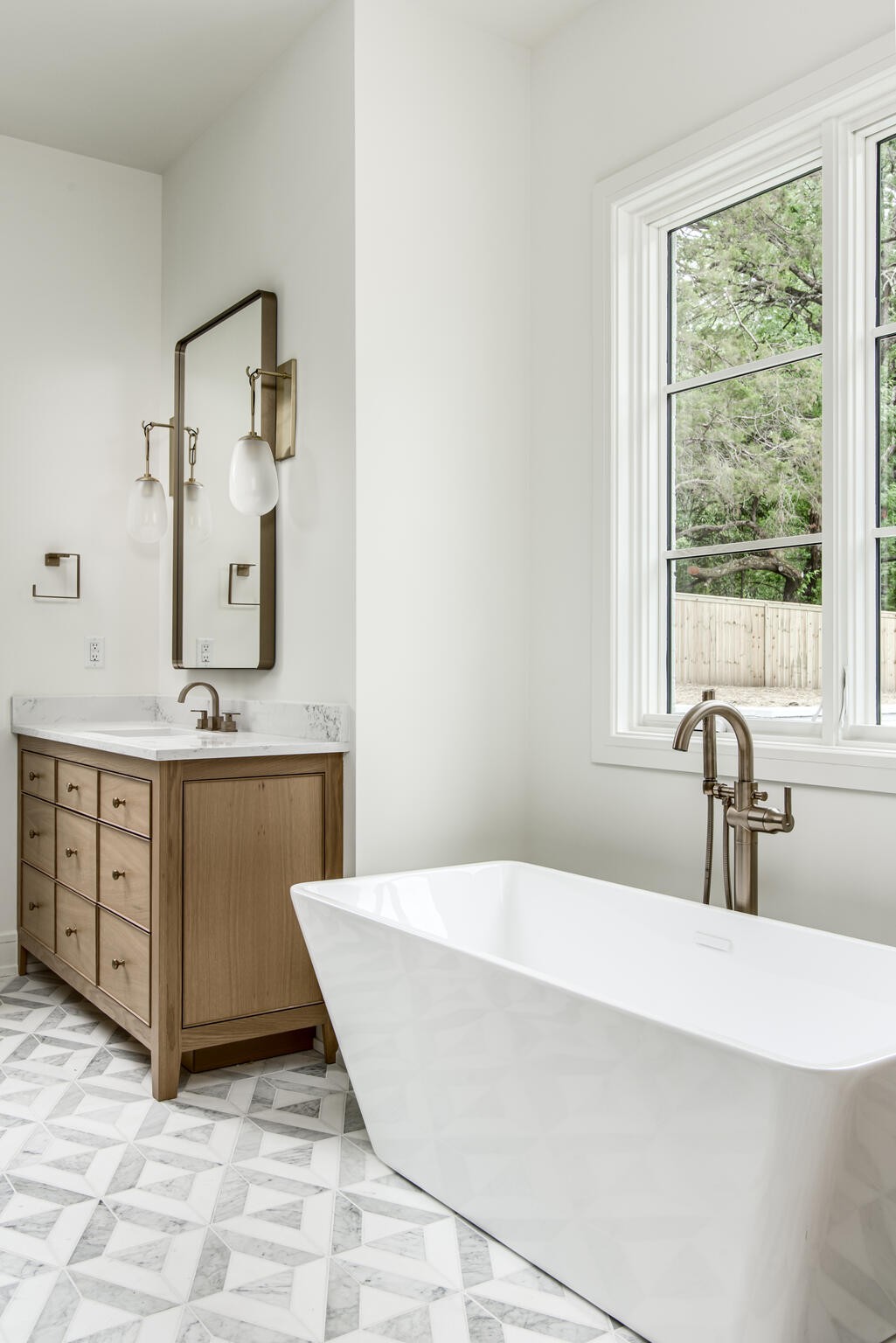 1401 Burton Valley Road Nashville, TN 37215 - Photo 33 of 68 a spacious bathroom with a double vanity sink a mirror and a bathtub