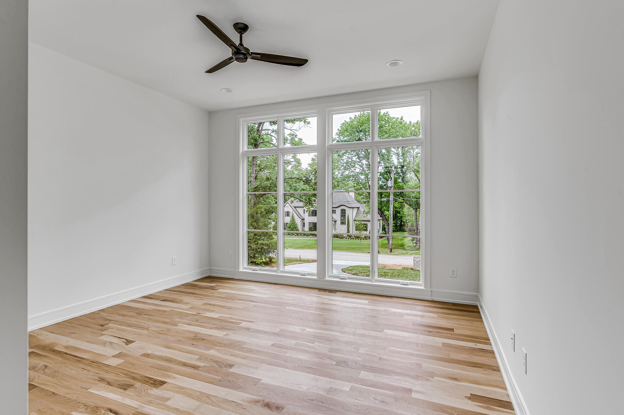 1401 Burton Valley Road Nashville, TN 37215 - Photo 36 of 68 a view of an empty room with wooden floor and a window