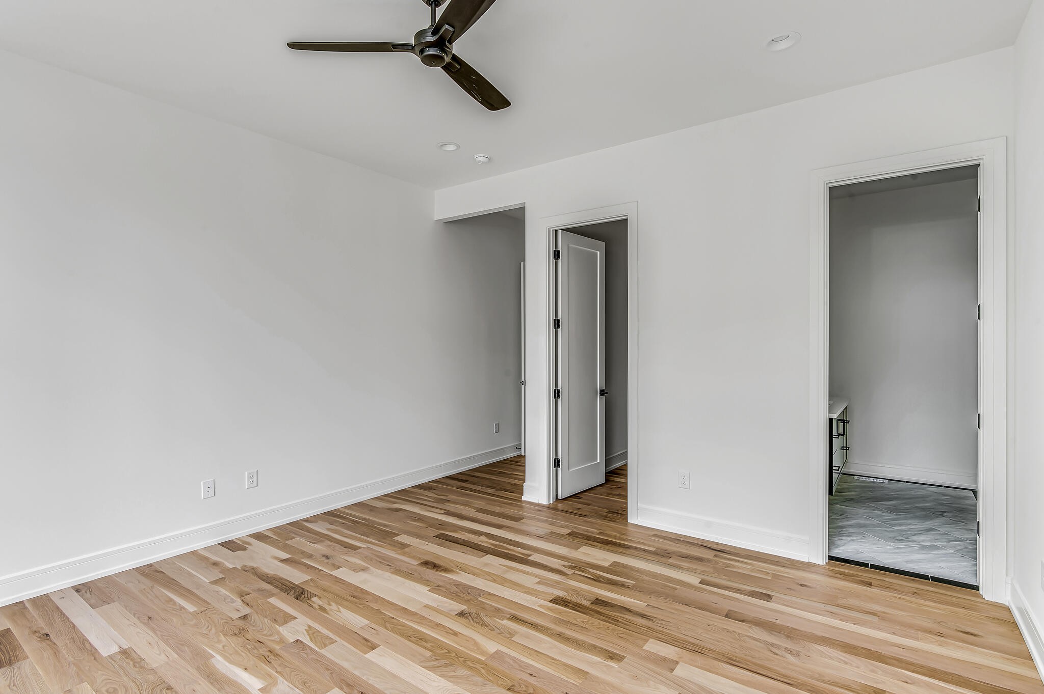 1401 Burton Valley Road Nashville, TN 37215 - Photo 37 of 68 a view of a room with wooden floor and a ceiling fan