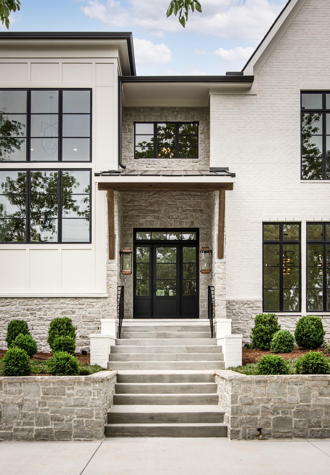 1401 Burton Valley Road Nashville, TN 37215 - Photo 4 of 68 a view of a house with potted plants and a fireplace