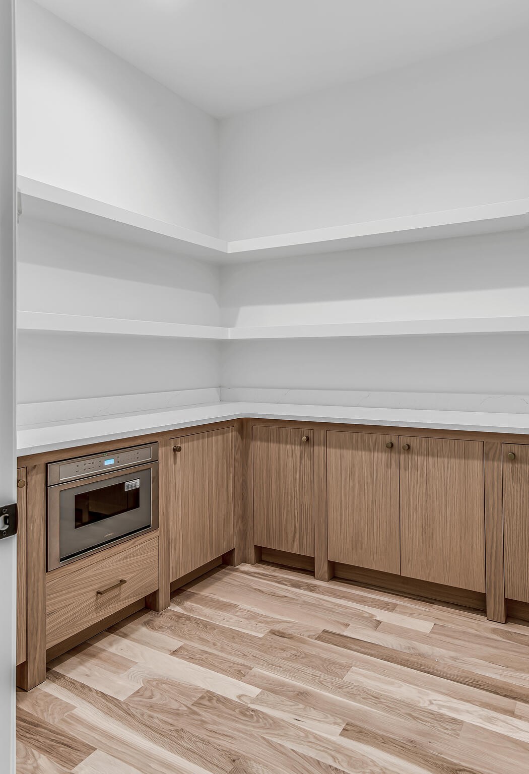 1401 Burton Valley Road Nashville, TN 37215 - Photo 41 of 68 a view of an empty room with kitchen and wooden floor