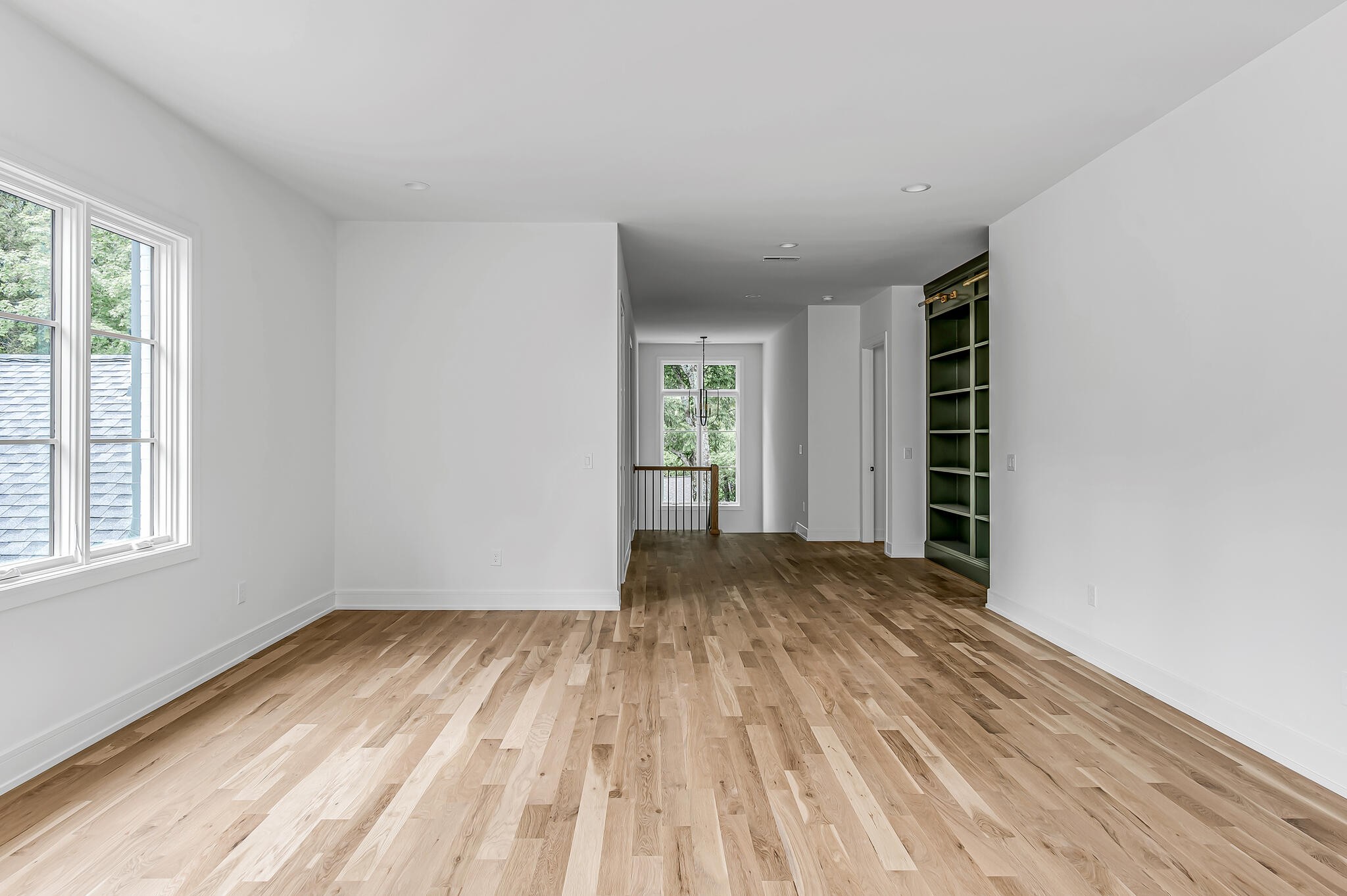 1401 Burton Valley Road Nashville, TN 37215 - Photo 45 of 68 a view of an empty room with wooden floor and a window