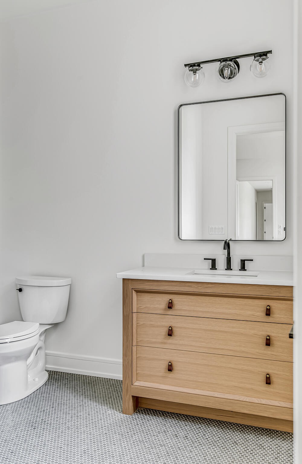 1401 Burton Valley Road Nashville, TN 37215 - Photo 53 of 68 a bathroom with a sink a toilet and mirror