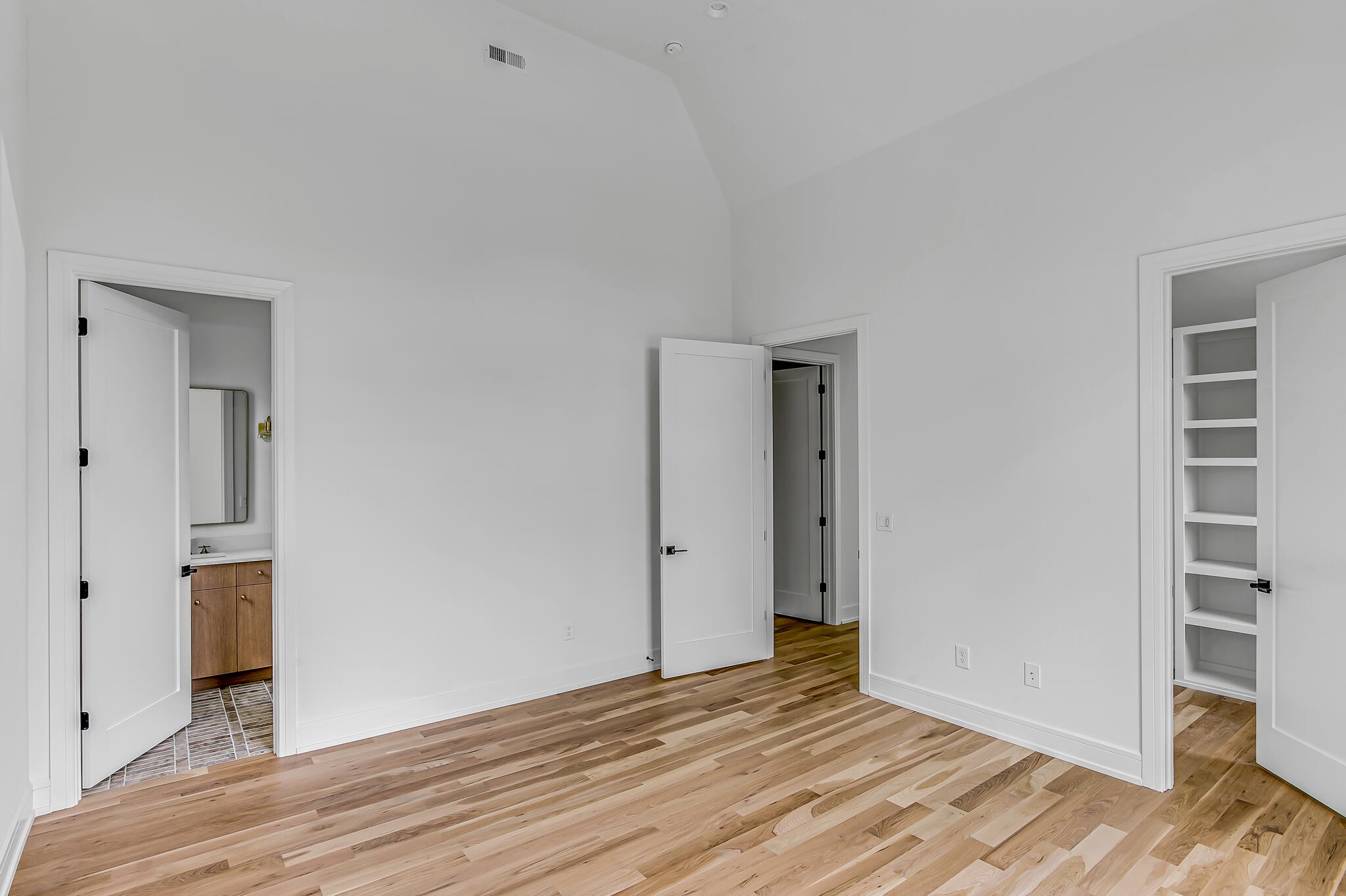 1401 Burton Valley Road Nashville, TN 37215 - Photo 58 of 68 a view of an empty room with wooden floor and closet