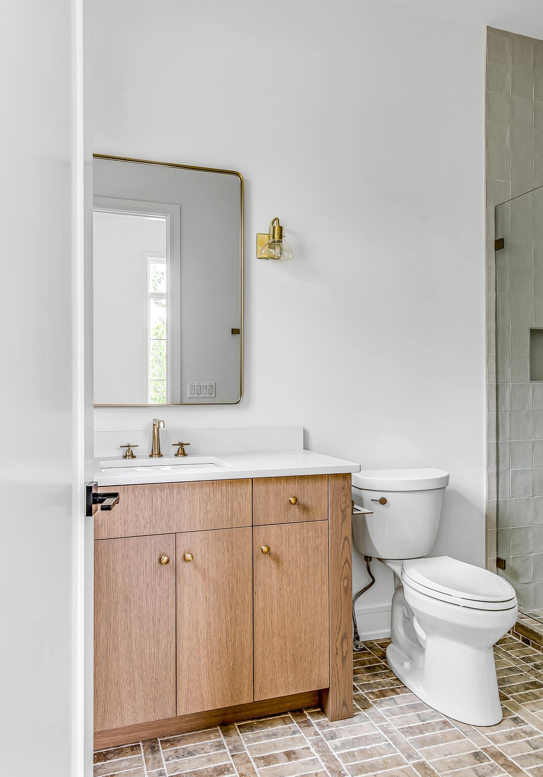 1401 Burton Valley Road Nashville, TN 37215 - Photo 59 of 68 a bathroom with a toilet a sink and mirror